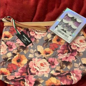 Leather wristlet with eyelashes bonus all new